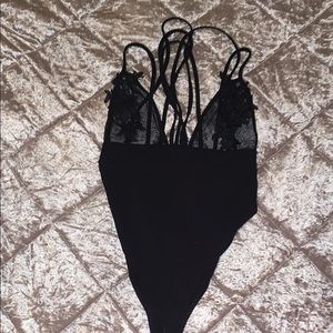 Black mesh and appliqué bodysuit